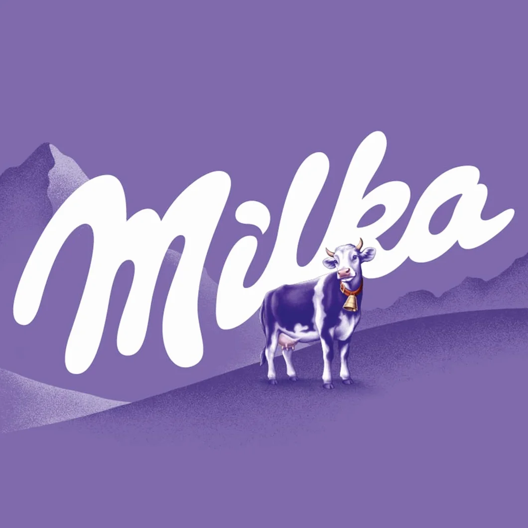 Milka Czekoladki mleczne z nadzieniem z orzechów laskowych 165 g