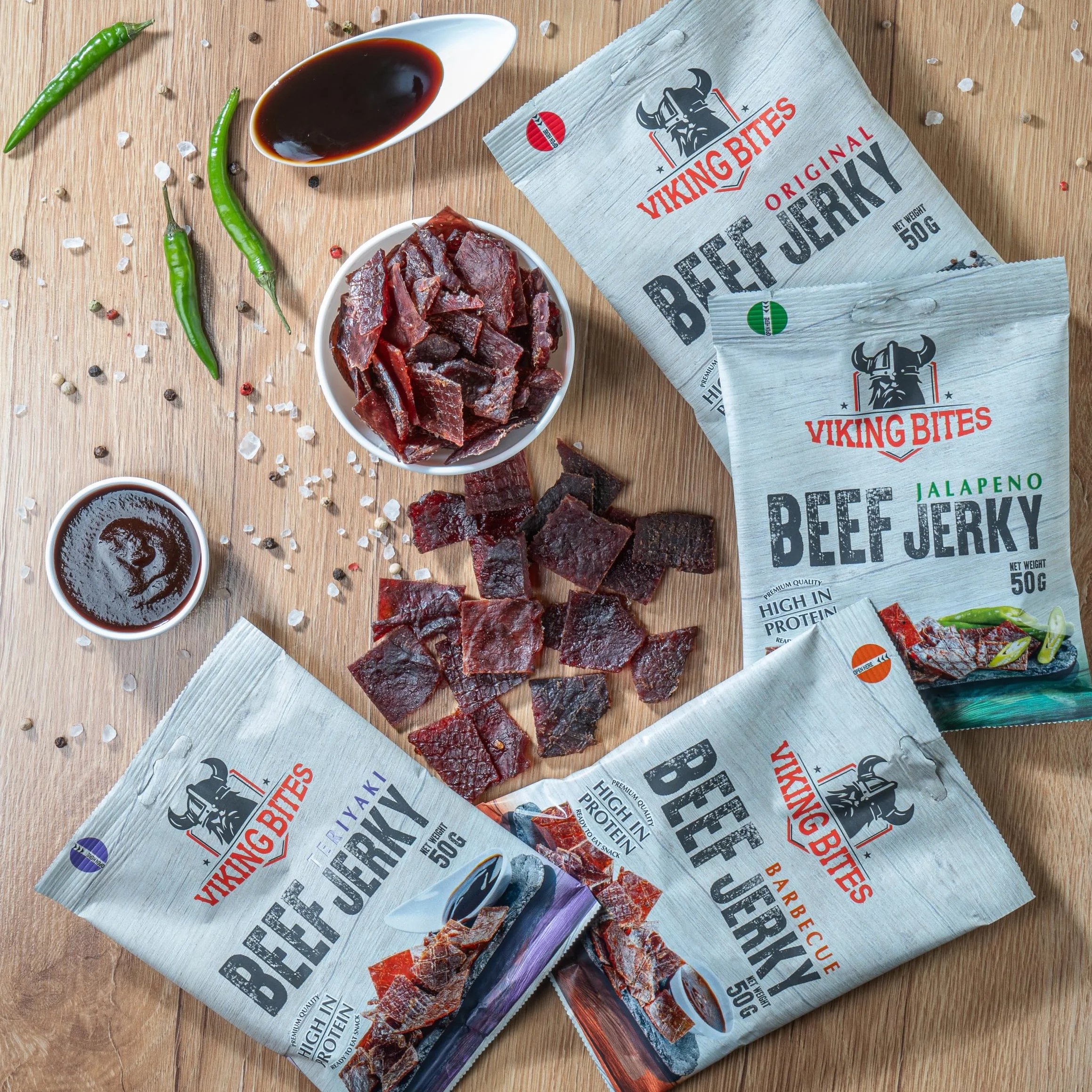 Viking Bites Beef Jerky Mixed box - 400 g (8 x 50 g) – mieszanka suszonej wołowiny, pudełko - 2x Oryginalna, 2x Jalapeno, 2x Barbecue, 2x Teriyaki – Przekąska mięsna o wysokiej zawartości białka